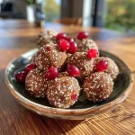 Close-up of energy balls made from sweet potatoes, oats, and cranberries, showcasing a textured surface.
