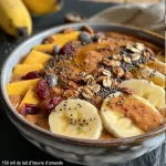 Close-up of a colorful autumn smoothie bowl topped with figs, bananas, and seeds.